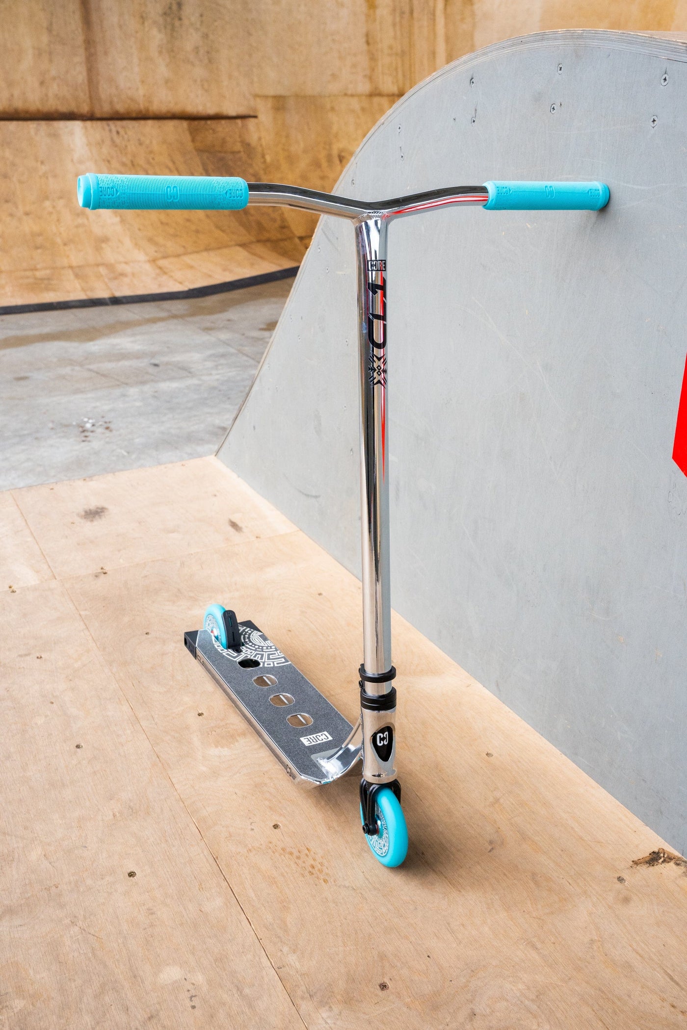 CORE CL1 Complete Stunt  Scooter Chrome & Teal I Adult Stunt Scooter Leaning