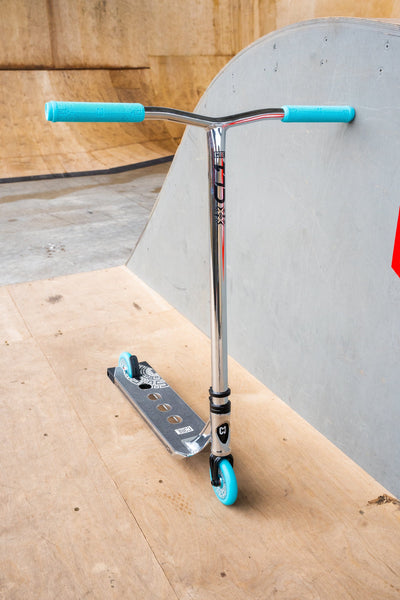 CORE CL1 Complete Stunt  Scooter Chrome & Teal I Adult Stunt Scooter Leaning