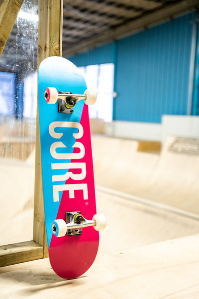 CORE Complete Skateboard C2 Split Pink & Blue 7.75 I Complete Skateboards Leaning