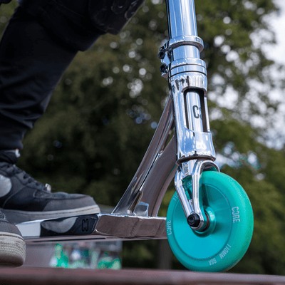 CORE SL2 Stunt Scooter Chrome & Teal I Adult Stunt Scooter Alternate Angle Ride