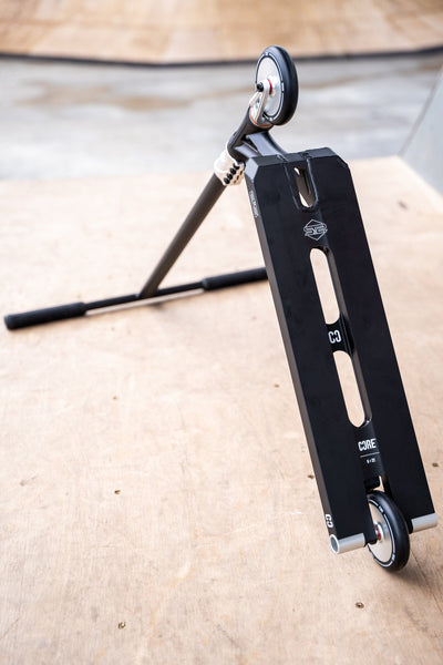 CORE ST2 Stunt Scooter Black & Raw I Adult Stunt Scooter Ground
